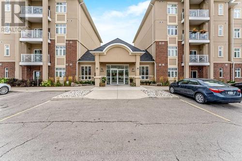 304 - 1370 Costigan Road, Milton, ON - Outdoor With Balcony With Facade