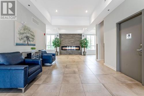 304 - 1370 Costigan Road, Milton, ON - Indoor Photo Showing Living Room With Fireplace