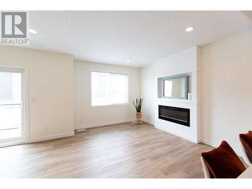 407 4274 22Nd Avenue, Prince George, BC - Indoor Photo Showing Living Room With Fireplace