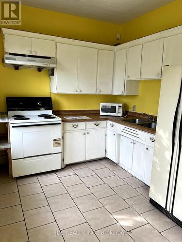 703-705 Partington Avenue, Windsor, ON - Indoor Photo Showing Kitchen With Double Sink