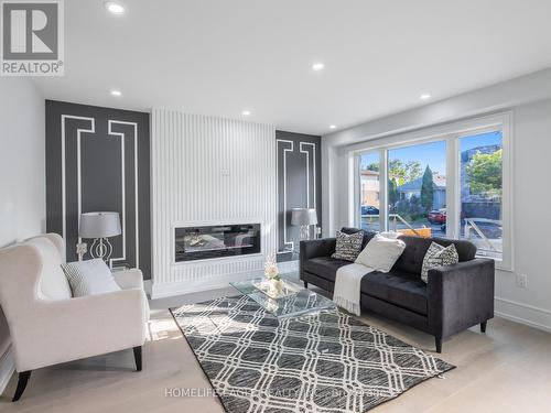 39 Commonwealth Avenue, Toronto (Kennedy Park), ON - Indoor Photo Showing Living Room With Fireplace