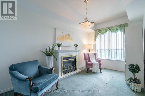 501 - 2085 Amherst Heights Drive, Burlington (Brant Hills), ON - Indoor Photo Showing Living Room With Fireplace