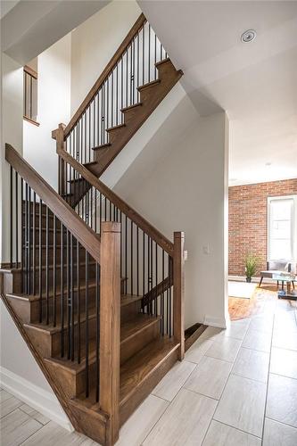 Be Treated By This Architecturally Impressive Solid Wood Staircase Leading Upstairs To Bedrooms and Downstairs To Basement Living Area - 147 Mountain Park Avenue, Hamilton, ON - Indoor Photo Showing Other Room