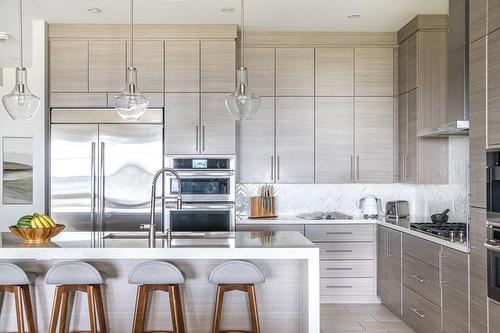 Quartz Waterfall Center Island Neatly Accommodates Seating For Four - 147 Mountain Park Avenue, Hamilton, ON - Indoor Photo Showing Kitchen With Upgraded Kitchen