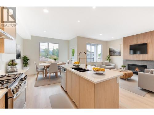 853 Kinnear Court, Kelowna, BC - Indoor Photo Showing Kitchen With Fireplace With Double Sink With Upgraded Kitchen