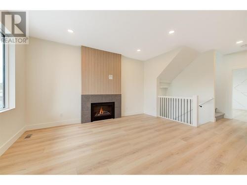 853 Kinnear Court, Kelowna, BC - Indoor Photo Showing Other Room With Fireplace