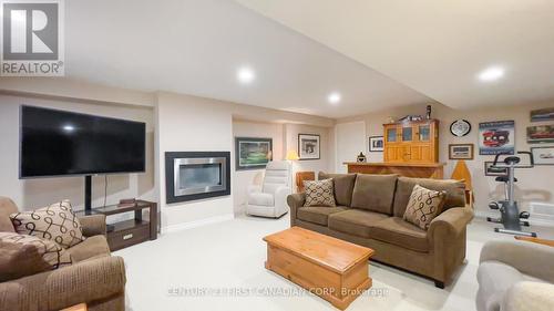 5 Oakwood Links Lane, Lambton Shores (Grand Bend), ON - Indoor Photo Showing Living Room With Fireplace