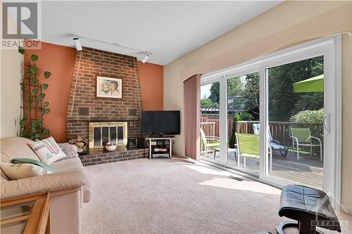 Wood burning fireplace - 35 Holitman Drive, Ottawa, ON - Indoor Photo Showing Living Room With Fireplace