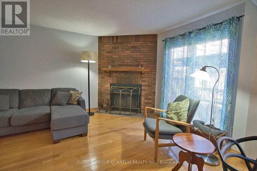 6 - 7 Davidson Boulevard, Hamilton (Dundas), ON - Indoor Photo Showing Living Room With Fireplace