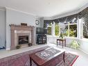 256-4488 Chatterton Way, Saanich, BC  - Indoor Photo Showing Living Room With Fireplace 