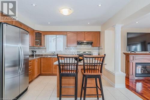 67 Revell Dr Drive, Guelph, ON - Indoor Photo Showing Kitchen With Fireplace With Double Sink