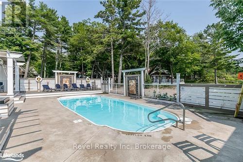 11A - 739 15 W, Tiny, ON - Outdoor With In Ground Pool