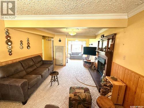 104 Pine Street, Chitek Lake, SK - Indoor Photo Showing Living Room With Fireplace