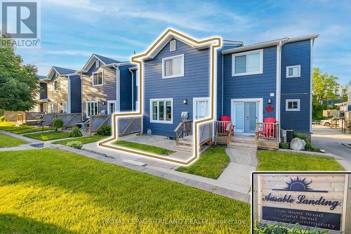 You can just see sunset lake view from street side - 4 - 5 River Road, Lambton Shores (Grand Bend), ON - Outdoor With Facade