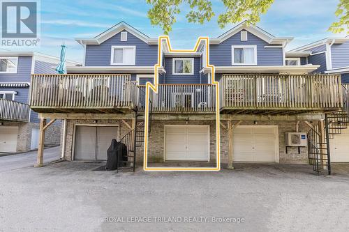 Riverfront side w/ riverfront balcony & garage. - 4 - 5 River Road, Lambton Shores (Grand Bend), ON - Outdoor With Balcony With Deck Patio Veranda