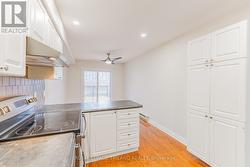 Kitchen, showing surplus pantry space on wall. - 