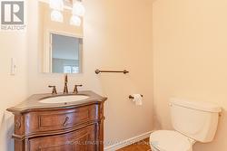 Let's head upstairs past the main level bathroom. - 