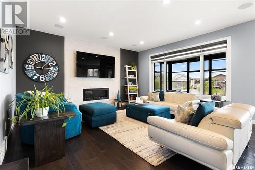 4422 Sage Crescent, Regina, SK - Indoor Photo Showing Living Room With Fireplace