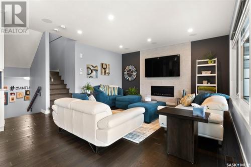 4422 Sage Crescent, Regina, SK - Indoor Photo Showing Living Room With Fireplace