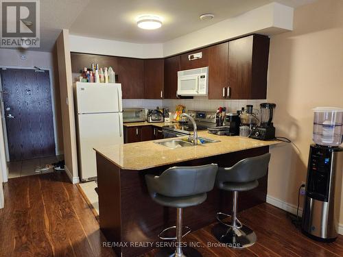 212 - 7405 Goreway Drive W, Mississauga (Malton), ON - Indoor Photo Showing Kitchen With Double Sink