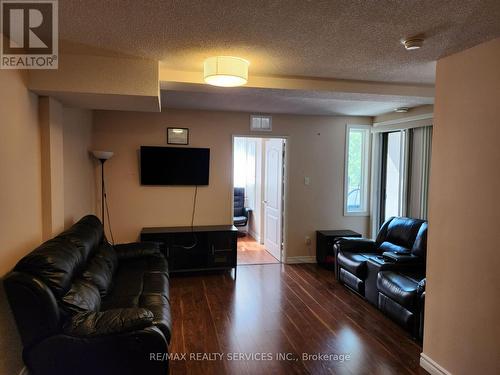 212 - 7405 Goreway Drive W, Mississauga (Malton), ON - Indoor Photo Showing Living Room