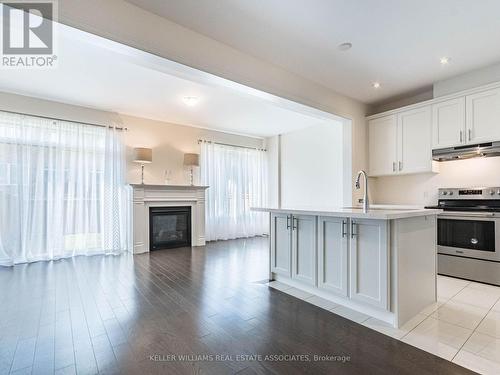 18 Heming Trail, Hamilton (Ancaster), ON - Indoor Photo Showing Kitchen With Fireplace