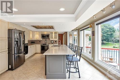 Chefs can perpare sumptuous meal using 2 ovens while enjoying the south facing sunshine from morning to night - 105 Locharron Crescent, Ottawa, ON - Indoor Photo Showing Kitchen