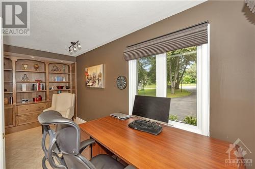 Close the french doors to the private office with built-in shelves facing the front. You'll see all the Amazon deliveries. - 105 Locharron Crescent, Ottawa, ON - Indoor Photo Showing Office