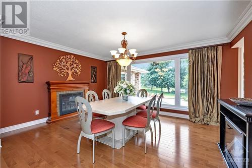 Dining room off the kitchen - open to the front and back. - 105 Locharron Crescent, Ottawa, ON - Indoor Photo Showing Dining Room With Fireplace