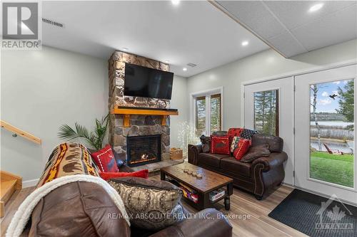 4634 Matawatchan Road, Greater Madawaska, ON - Indoor Photo Showing Living Room With Fireplace