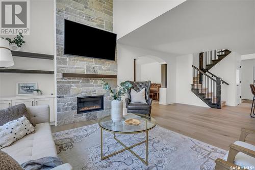 203 Adaskin Cove, Saskatoon, SK - Indoor Photo Showing Living Room With Fireplace