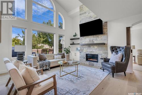 203 Adaskin Cove, Saskatoon, SK - Indoor Photo Showing Living Room With Fireplace