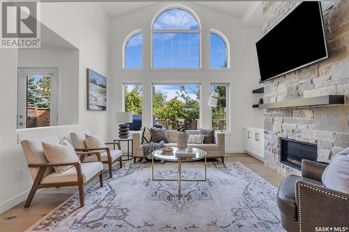 203 Adaskin Cove, Saskatoon, SK - Indoor Photo Showing Living Room With Fireplace