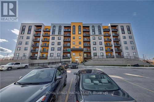 201 - 8 Culinary Lane, Barrie, ON - Outdoor With Balcony With Facade