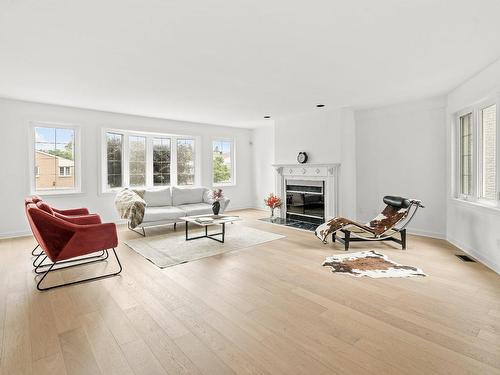 Living room - 28 Av. Greystone, Pointe-Claire, QC - Indoor Photo Showing Living Room With Fireplace