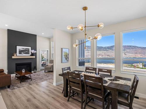 323 Rue Cheval Noir, Kamloops, BC - Indoor Photo Showing Dining Room With Fireplace