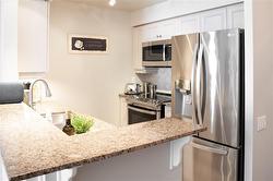 Granite Countertops with new Stainless Appliances - 