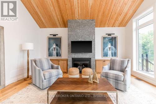 8 - 1841 Muskoka Road 118 W, Bracebridge, ON - Indoor Photo Showing Living Room With Fireplace