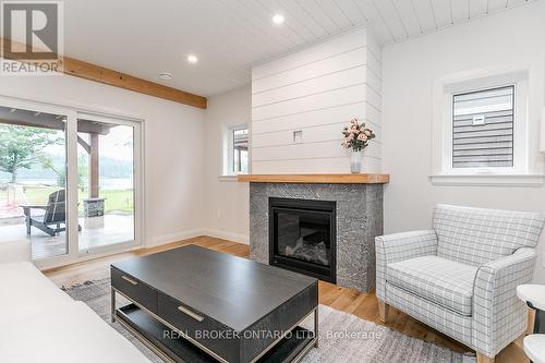 8 - 1841 Muskoka Road 118 W, Bracebridge, ON - Indoor Photo Showing Living Room With Fireplace