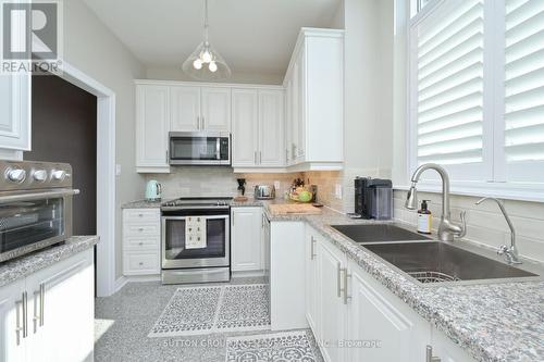 110 - 4 Briar Hill Heights, New Tecumseth, ON - Indoor Photo Showing Kitchen With Stainless Steel Kitchen With Double Sink With Upgraded Kitchen