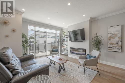 908 - 460 Callaway Road, London, ON - Indoor Photo Showing Living Room With Fireplace