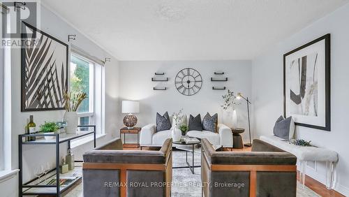 207 - 6442 Finch Avenue W, Toronto (Mount Olive-Silverstone-Jamestown), ON - Indoor Photo Showing Living Room