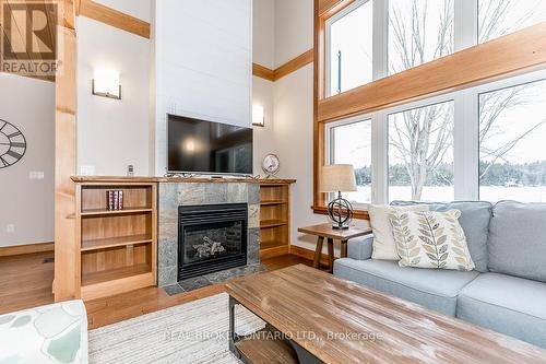 1B - 1841 Muskoka Road 118 W, Bracebridge, ON - Indoor Photo Showing Living Room With Fireplace