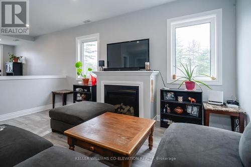 10 Elm Drive, Wasaga Beach, ON - Indoor Photo Showing Living Room With Fireplace