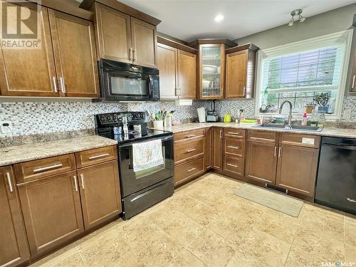 41 4Th Avenue, Battleford, SK - Indoor Photo Showing Kitchen With Double Sink