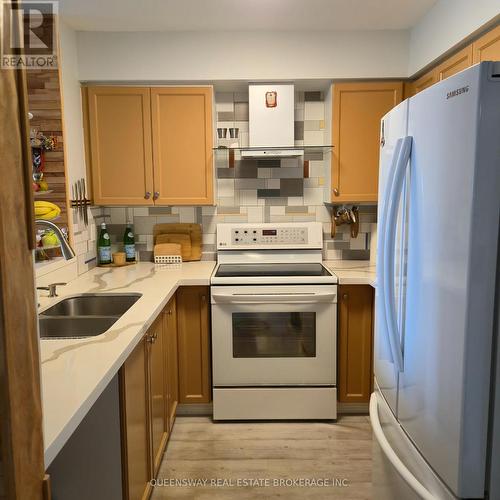 Ph-107 - 1 Emerald Lane, Vaughan, ON - Indoor Photo Showing Kitchen With Double Sink