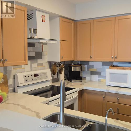 Ph-107 - 1 Emerald Lane, Vaughan, ON - Indoor Photo Showing Kitchen With Double Sink