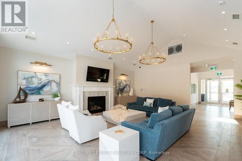 415 - 100 The Promenade, Central Elgin (Port Stanley), ON - Indoor Photo Showing Living Room With Fireplace