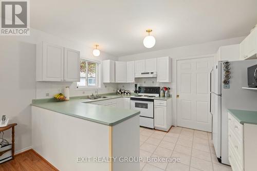 7 Cretney Drive, Prince Edward County (Wellington), ON - Indoor Photo Showing Kitchen With Double Sink