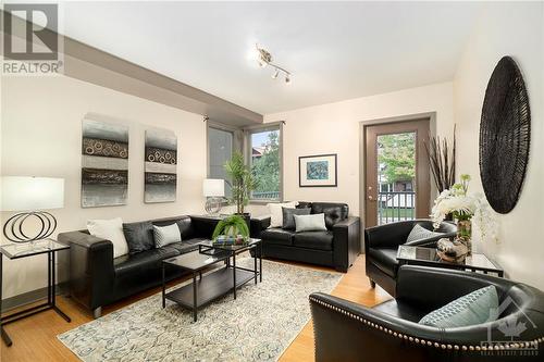 Living Room with door leading to generous deck - 474 Sunnyside Avenue, Ottawa, ON - Indoor Photo Showing Living Room